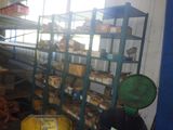 a man that is standing in front of a rack of food