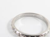 an image of a close up of a ring on a white surface