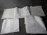 four pieces of white linen with embroidered trims and a monogrammed monogram