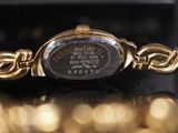 an image of a close up of a wrist watch on a table