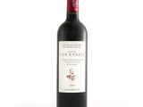 a bottle of red wine that is sitting on a table