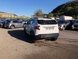 a lot of cars parked in a parking lot on a sunny day