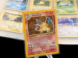 a lot of pokemon cards sitting on a table