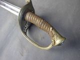 a close up of a sword that is on a table