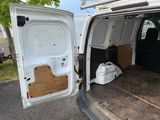 a white van with the door open and a box in the back
