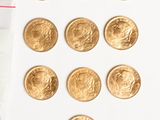 a bag of gold coins next to a bag of gold coins