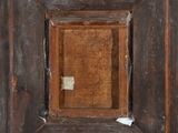 a picture of a wooden frame with a hole in it