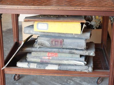 a table with several books stacked on top of it