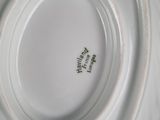 a white plate that has a black and white design on it