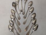 a lot of spoons arranged in the shape of a tree