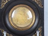a picture of a clock with a picture of a woman on it