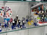 a glass display case with many different watches on it