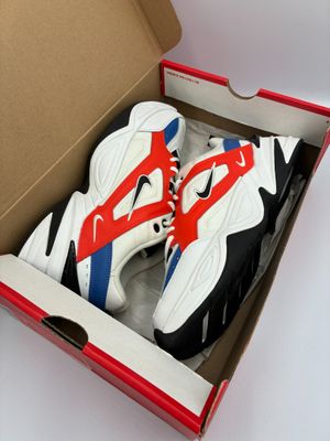 the box is open to show a pair of sneakers in it