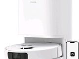 une image d'un Roomba avec une télécommande