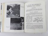 an open book with pictures of people and animals in it