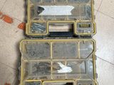 two tools in the case on the floor next to each other
