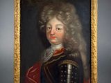 a painting of a man with long hair wearing armor