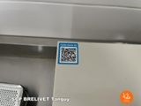 a qr code sticker on the side of a refrigerator