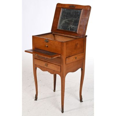 an old wooden desk with a mirror on top