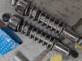 a close up of a motorcycle engine and parts on the ground