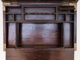a wooden desk with a clock on top of it
