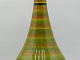 an image of a green and black vase with a light on top