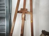 a picture of a wooden easel with a picture on it