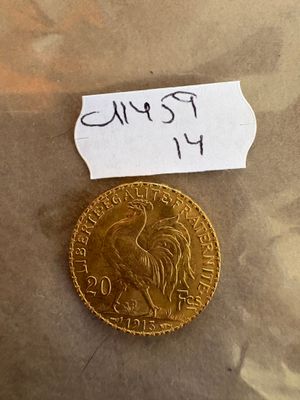 une photo d'une pièce d'or sur laquelle est apposée une étiquette