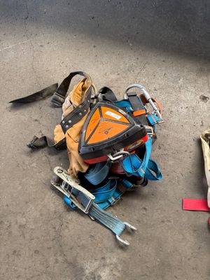 an image of a pile of luggage and tools on the ground