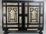 a black and white cabinet with two doors and two drawers