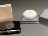 a small box and a small container with a white substance