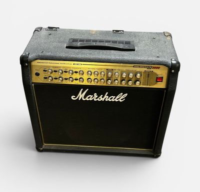 an old marshall amplifier sitting on top of a white surface