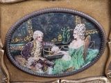 a picture of a picture of a man and a woman sitting at a table