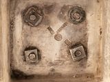 a picture of a metal box with nuts and bolts on it