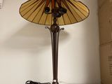 a lamp that is sitting on top of a microwave