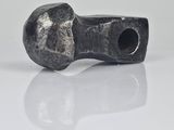 a close up of a metal object on a white surface