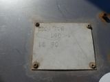a sign on the side of a metal tank