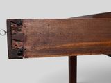 a close up of a wooden table with a metal frame
