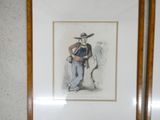 a framed picture of a man in a cowboy hat
