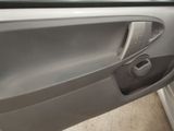 the door handle of a car is open to show the interior