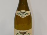 a bottle of wine that is sitting on a table
