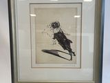 framed drawing of a bird sitting on top of a wooden easel