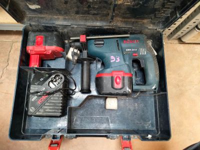a box with tools in it sitting on the floor
