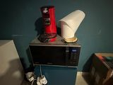 a microwave sitting on top of a microwave oven
