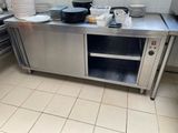 a kitchen with a lot of plates and bowls on the counter