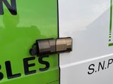 a close up of a green and white van with the word bless written on the side