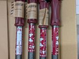 three red and black fire extinguisors sitting in a cardboard box