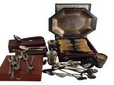 a wooden box with silverware and spoons in it