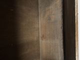 a wooden box with a door open on a white background