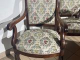 two chairs that are next to each other on a tiled floor